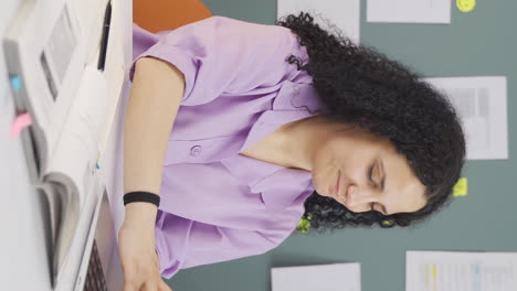 vertical video of satisfied female student at pc.