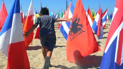 child running through national flags