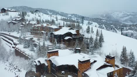 Aerial-shot-of-Escaping-to-the-Snow-Covered-Mountains-of-Utah:-A-Winter-Wonderland-Vacation,-Offering-Frosty-Landscapes-and-Luxurious-Amenities-in-a-Majestic-Alpine-Setting