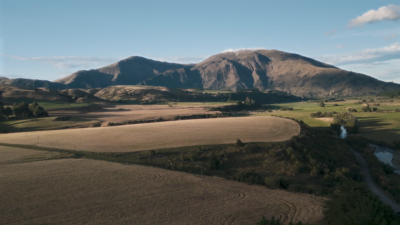 Mountainous Rural Landscape with Fields and River