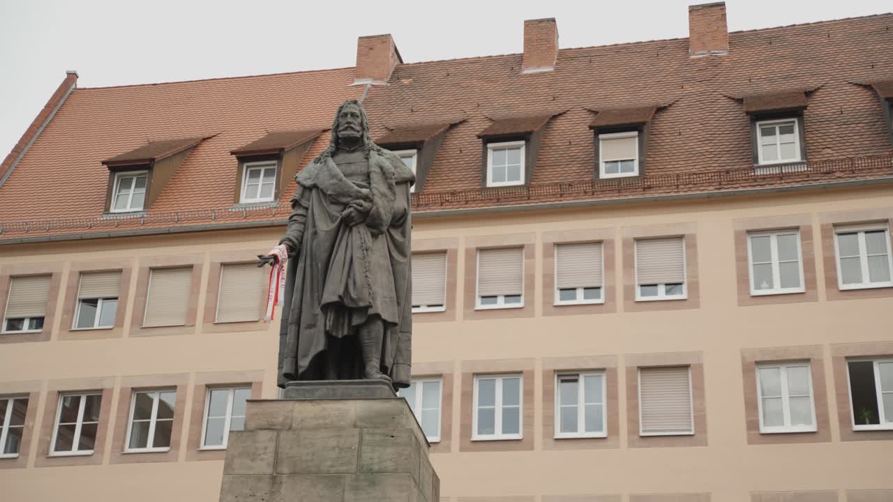 Statue positioned in front of a house, perfect for architecture, art, and cultural content