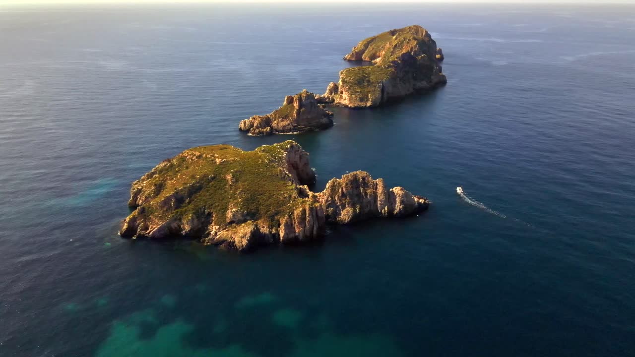 Experience breathtaking aerial views of the beautiful coastline near Santa Ponsa in Mallorca. Crystal-clear waters and rocky islands create a serene and picturesque landscape.