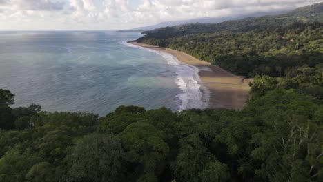 Aerial-view-of-a-beautiful-empty-Costa-Rican-coastline-with-sand-beach