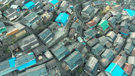 aerial view of the largest gurung village bhujung on a slope of a hill
