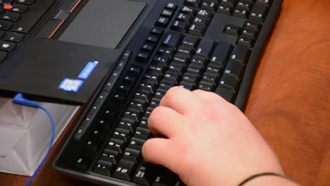 woman typing on keyboard close up