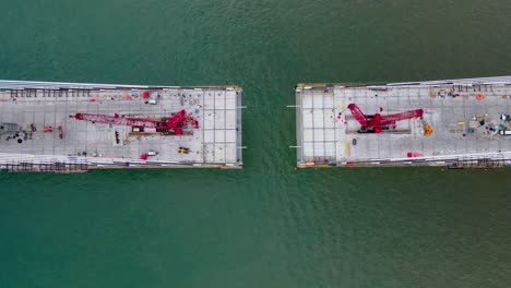 aerial view of gordie howe international bridge construction over the detroit river