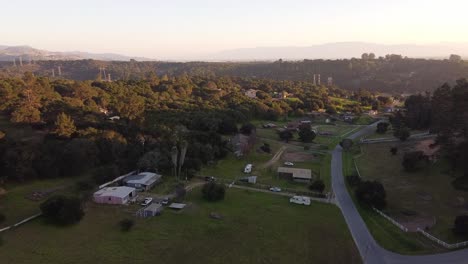 tiny rural town of prunedale on sunny day, aerial flying over view