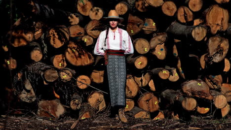 romanian girl sits on the cut trees 4