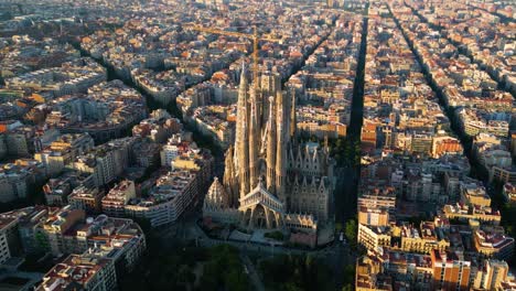 barcelona eixample residential district and famous basilica sagrada familia at sunset. catalonia, spain