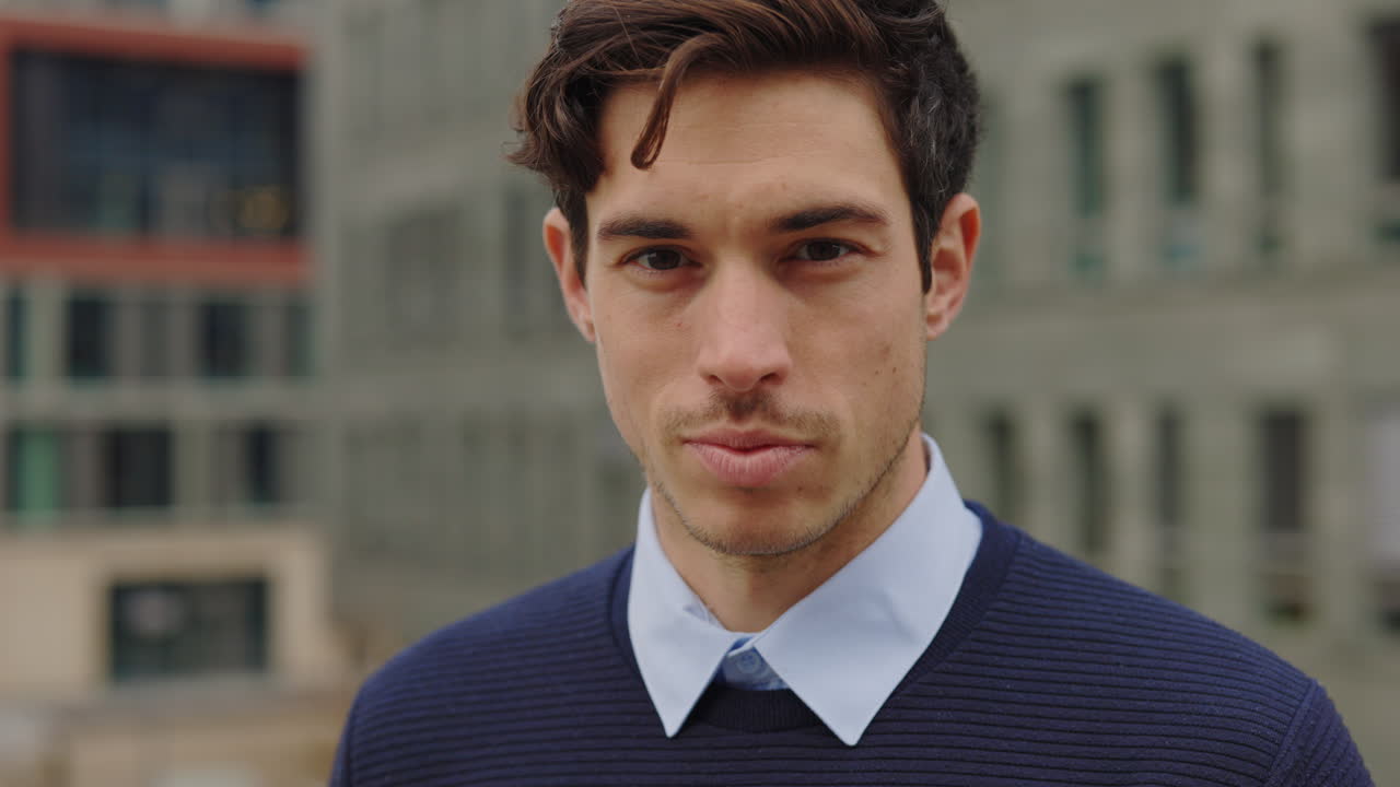 Portrait of a man in a sweater and shirt