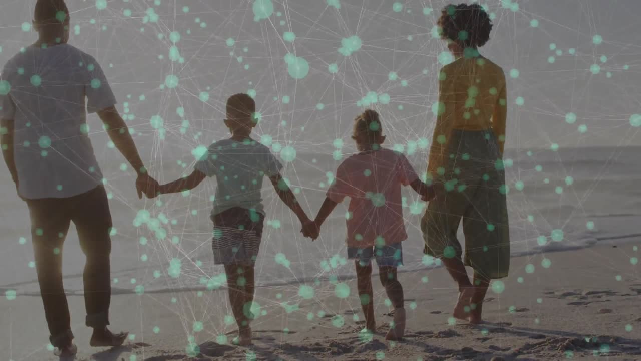 Family walking toward shore holding hands, teal overlay partially obscuring figures for tech