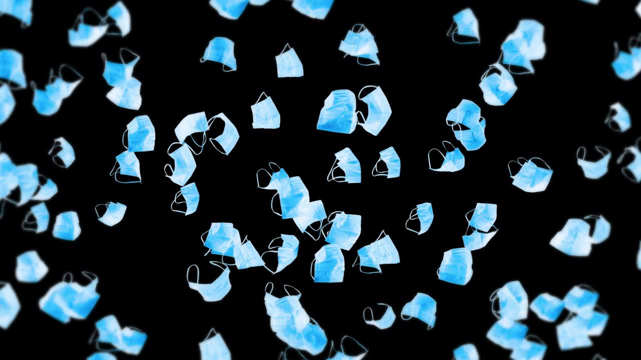 검은 바탕에 많은 파란 마스크를 날아. 의료 개념. 수술 보호 마스크. 마스크 회전의 3d 애니메이션. 루프 애니메이션.