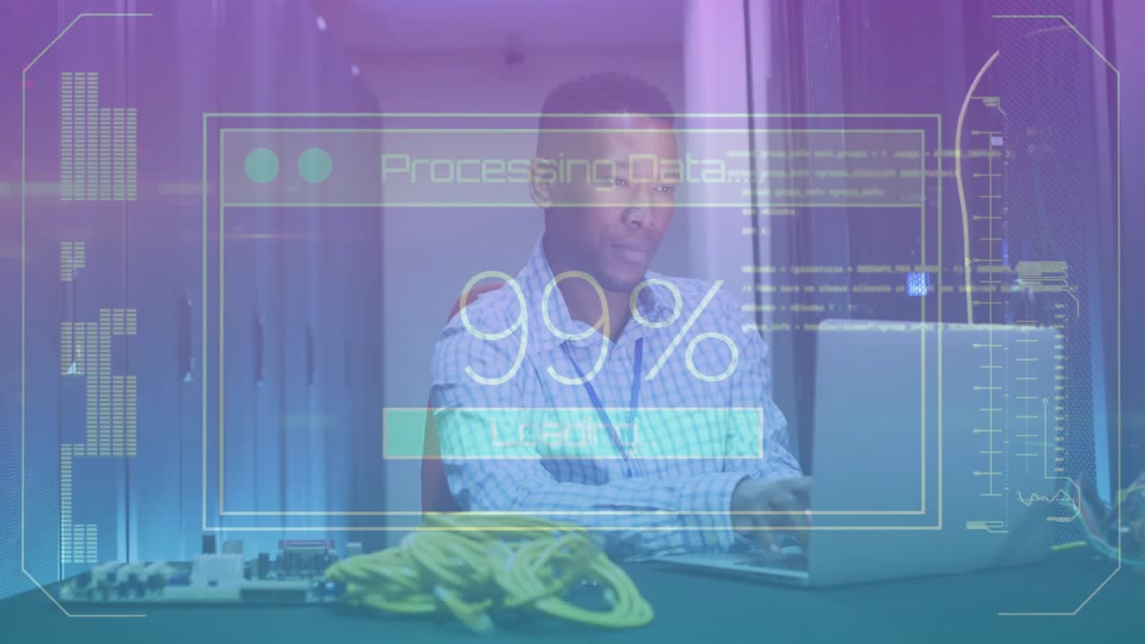 Man sitting at data center desk using laptop while processing data overlay reaching 100% fading