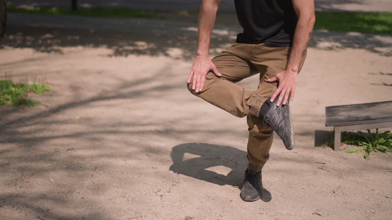 Man Balancing Outdoors, Male Practicing Onelegged Stance Outside, Individual Maintaining Stability In Outdoor Environment, Man Focuses On Balancing On One Foot During Outdoor Exercise Session