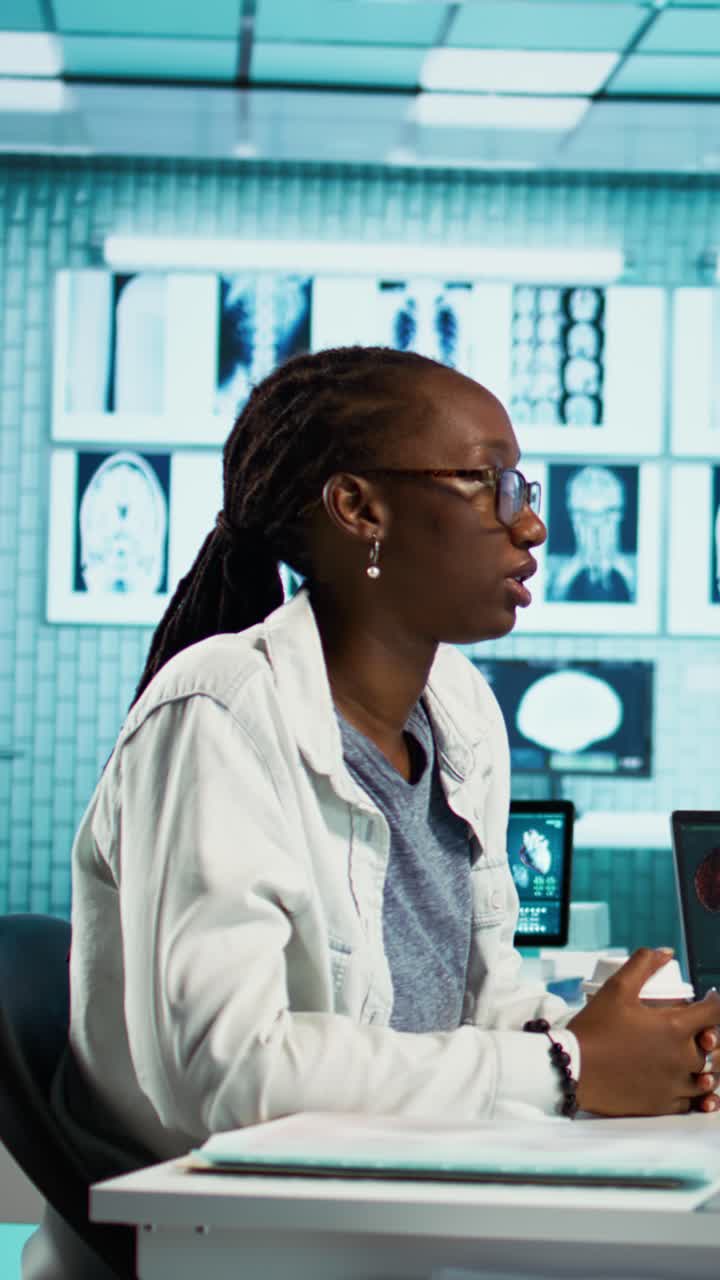 African American Doctor Discussing Brain Scans in Modern Medical Lab