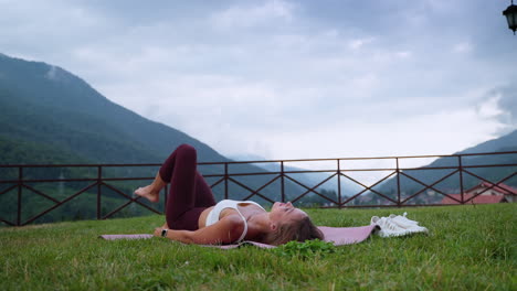 woman practicing yoga outdoors in nature