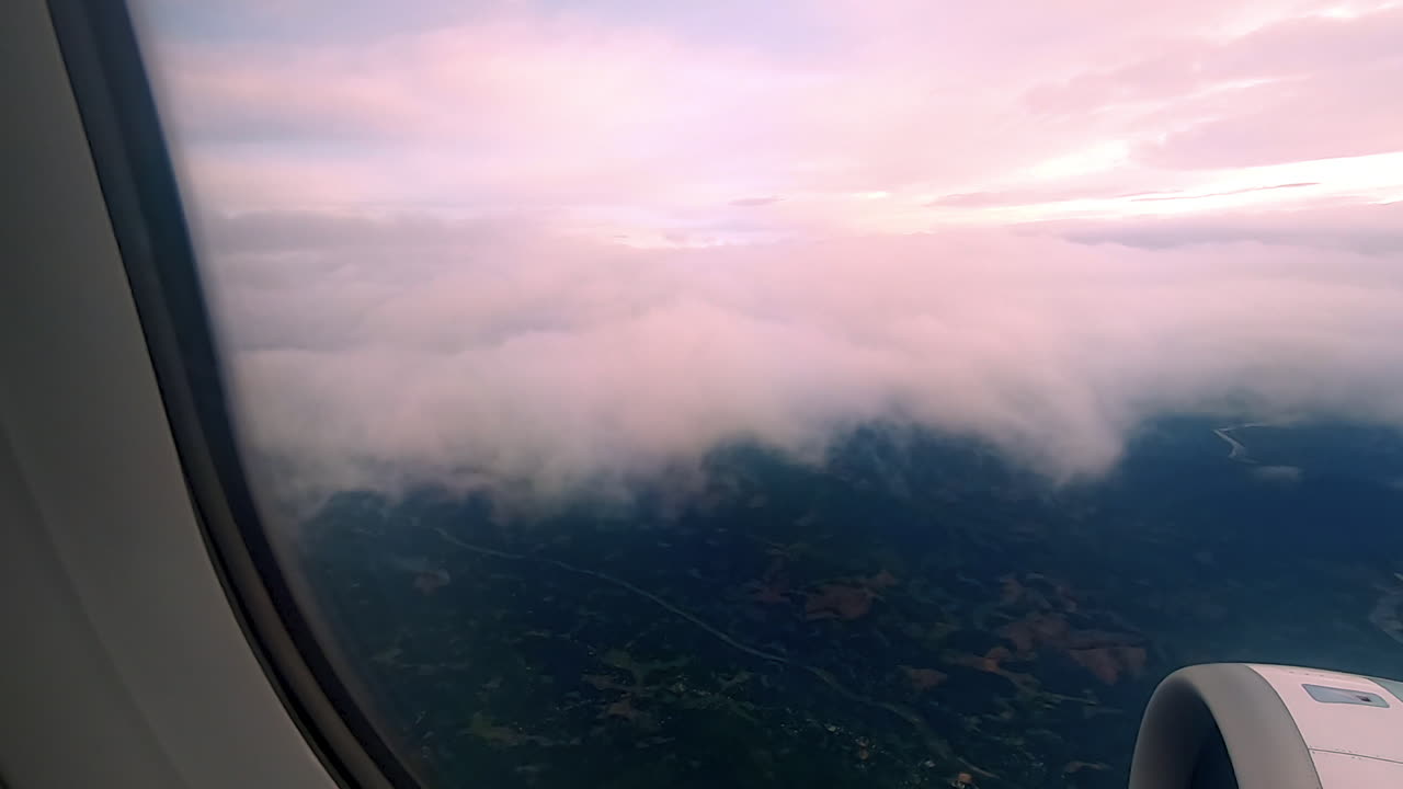 Looking at the clouds and Da Nang city in the airplane in Asia.