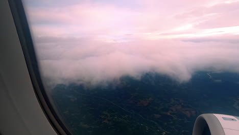 looking at the clouds and da nang city in the airplane in asia.