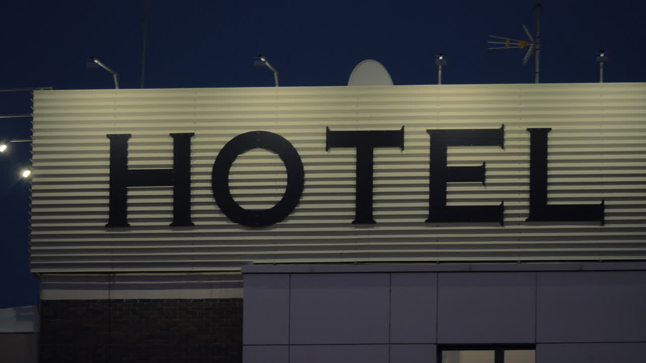 Night view of hotel banner in the street
