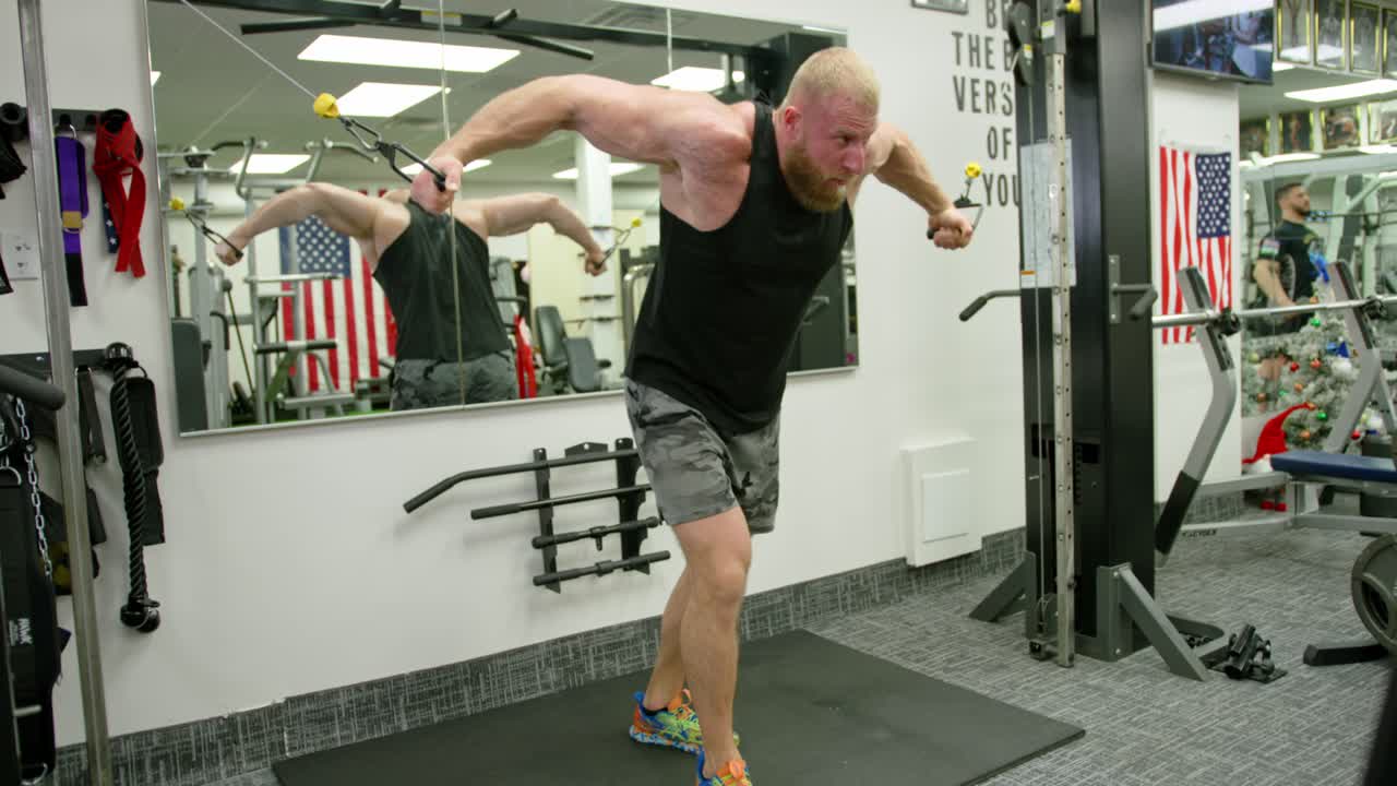 Strong bodybuilder lifting weights. Athletic person effort