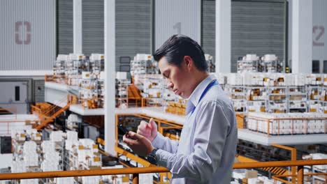 warehouse employee using smartphone