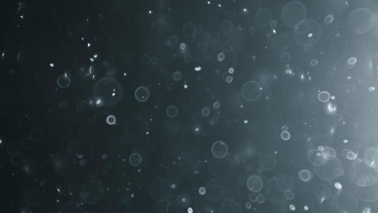 bokeh de partículas abstractas flotantes sobre fondo oscuro