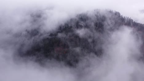 aerial view of mountain moving clouds during autumn fall in vosges, france, 4k