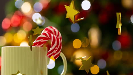 Animation-Von-Weihnachtsdekorationen-Mit-Goldenen-Sternen-über-Einer-Tasse-Mit-Zuckerstangen-Hintergrund