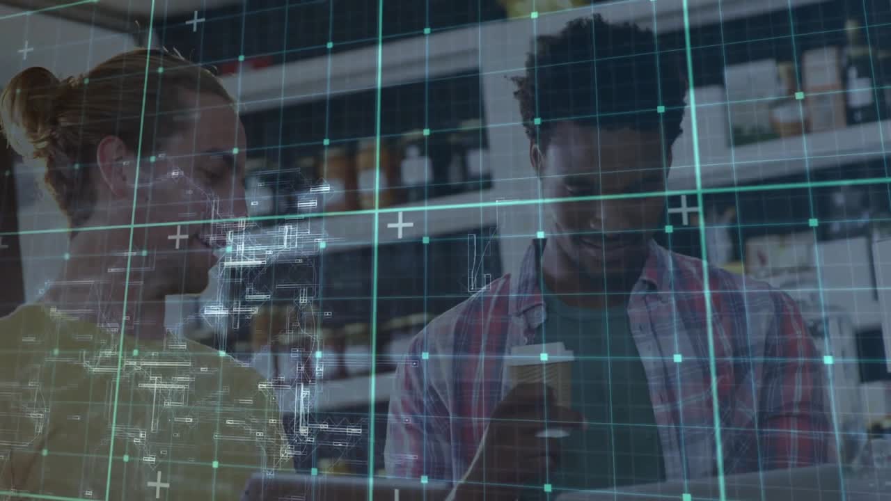 Two coworkers scrolling smartphone and showing data overlay while analyzing business data on laptop