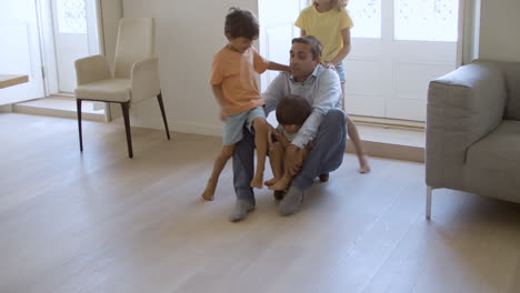 Elder-sister-wheeling-longboard-with-little-brothers