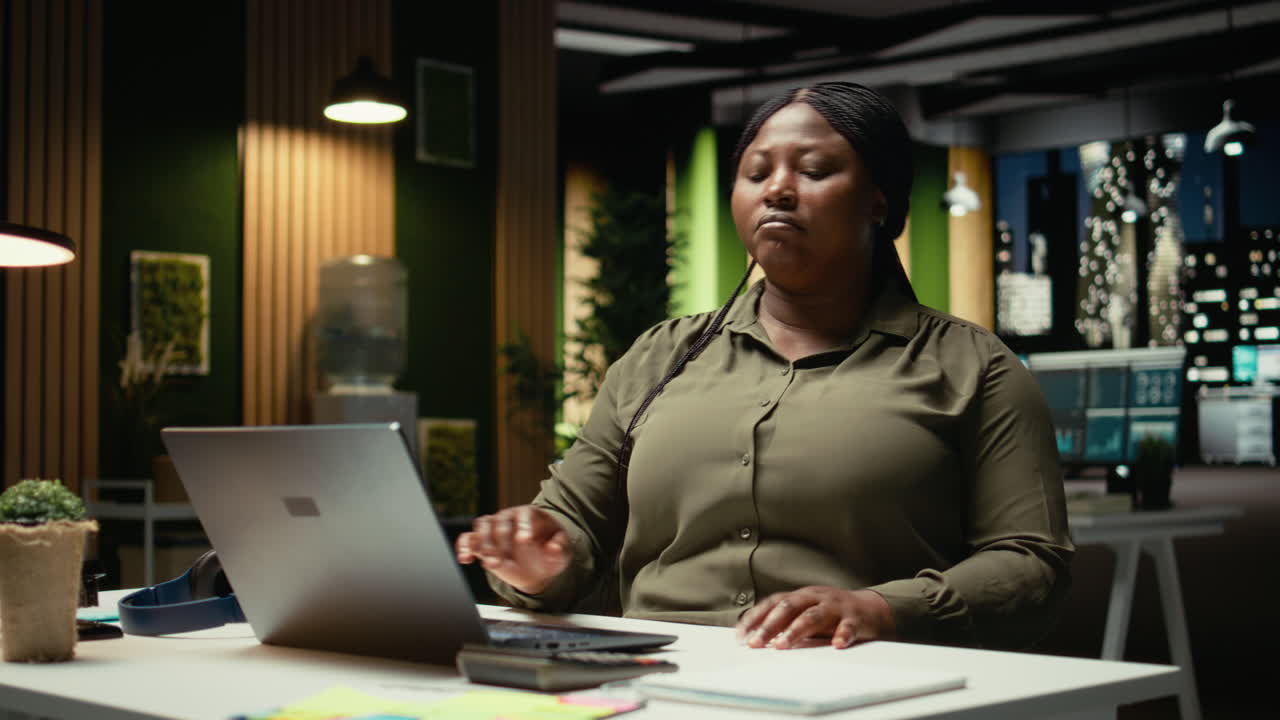 African american woman at the firm office in deep concentration