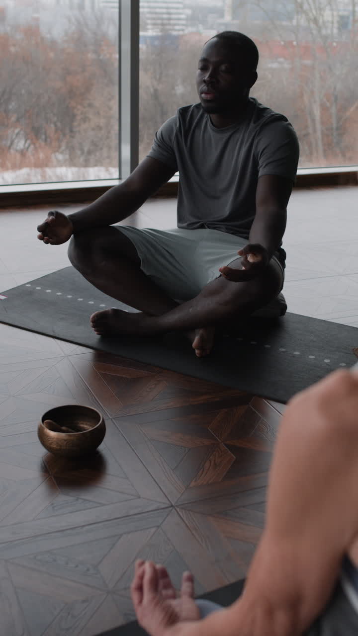 Man Meditating in a Yoga Class