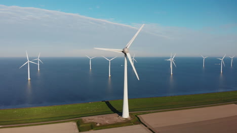 wind turbines in calm blue sea on a sunny day in netherlands