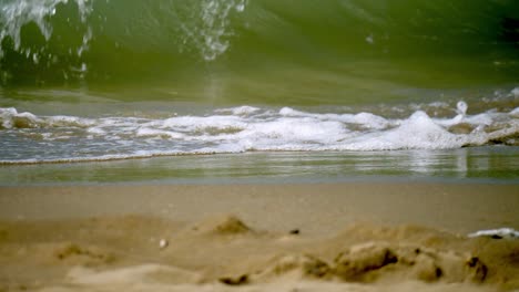 Waves-rolling-back-and-forth-at-the-beachfront-of-Pattaya-Beach-in-Chonburi-province,-Thailand