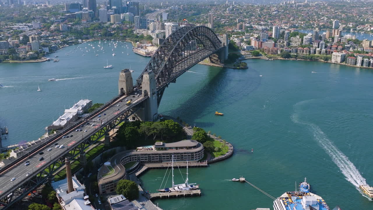 Aerial view tilting toward the Harbour bridge, sunny day in Sydney, Australia