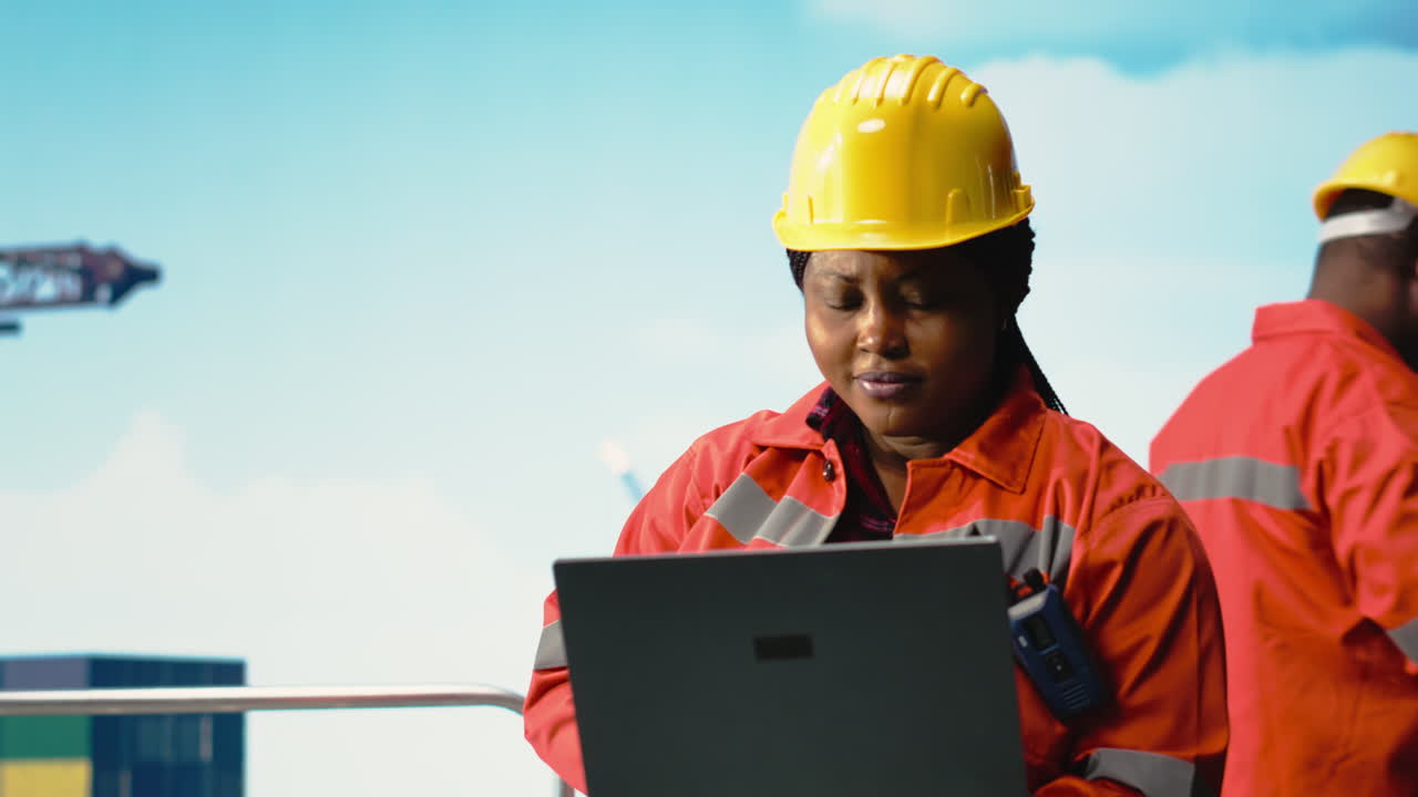 Vertical video Portrait of smiling offshore platform engineer tracking pollution data