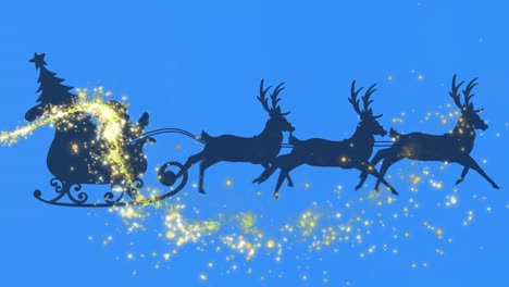 shooting star over silhouette of santa claus in sleigh being pulled by reindeers on blue background