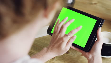Green-screen-hands-using-digital-tablet-touchscreen-device-ipad-in-cafe