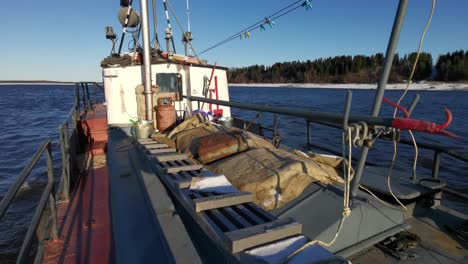 fishing boat on a river in winter