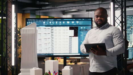 property investment developer checks blueprints and layout plans