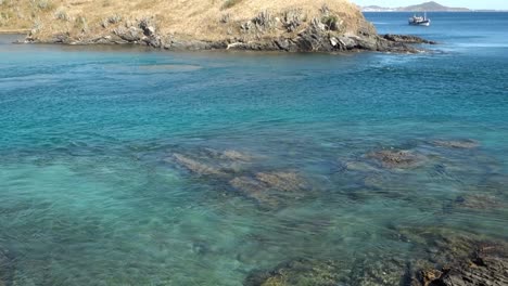 Tilt-up-reveals-an-amazing-paradisiacal-scenery-on-sea-coast-with-clear-turquoise-water