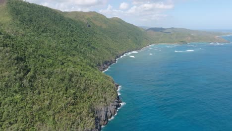 Aerial-shot-of-the-headland-and-fertile-bay-of-Loma-Papa-Gorda-in-Samana,-Dominican-Republic