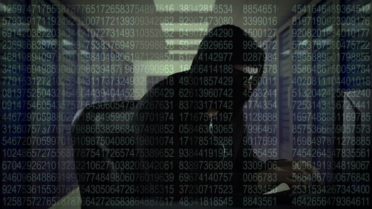 Animation of data processing over caucasian male hacker using computer in server room