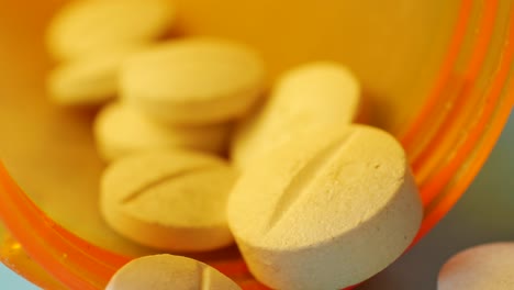 close-up of pills in an orange container