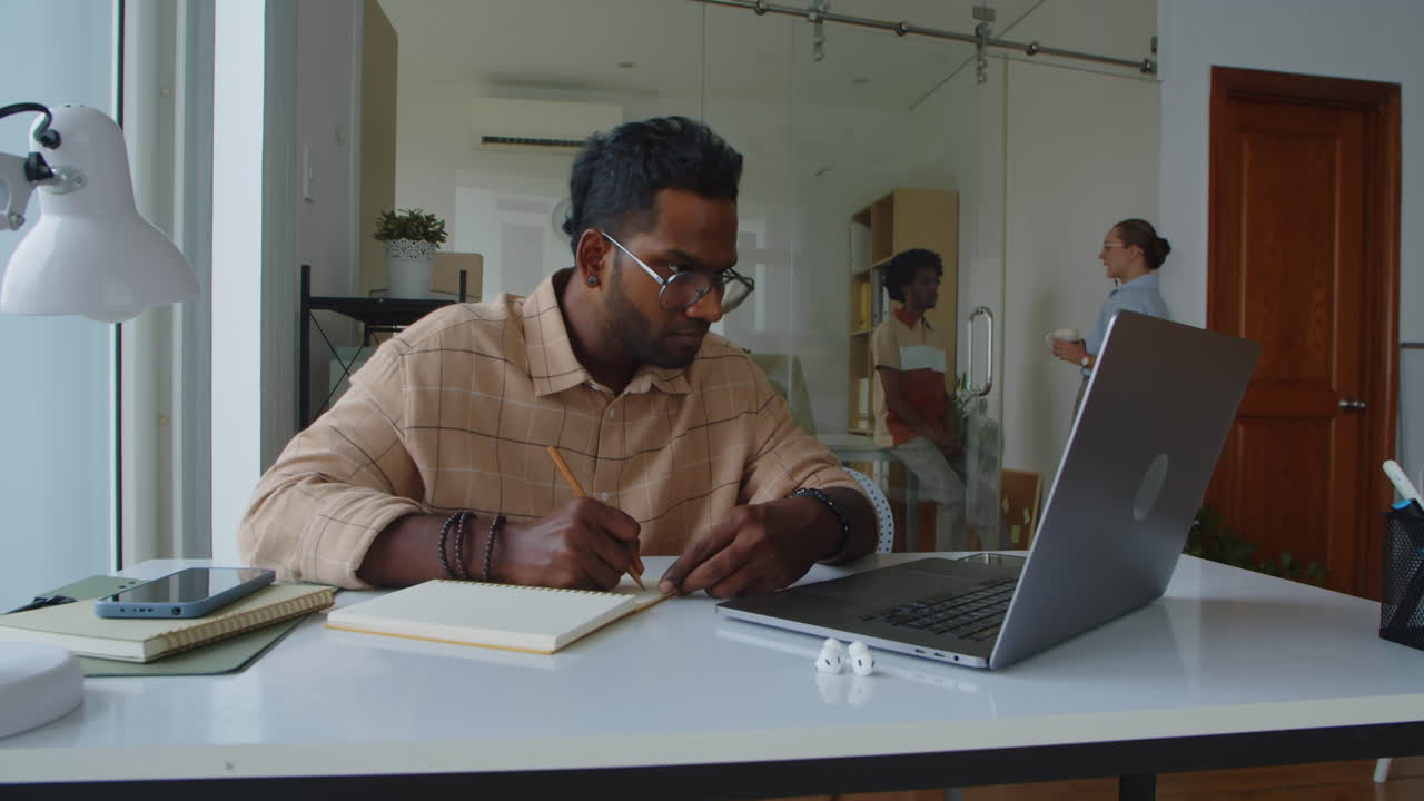 Programmer Developing Applications for PC and Laptops in Office