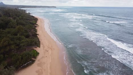 Ocean-background,-bright-blue-sky-with-white-clouds,-golden-sand-beach-and-waves