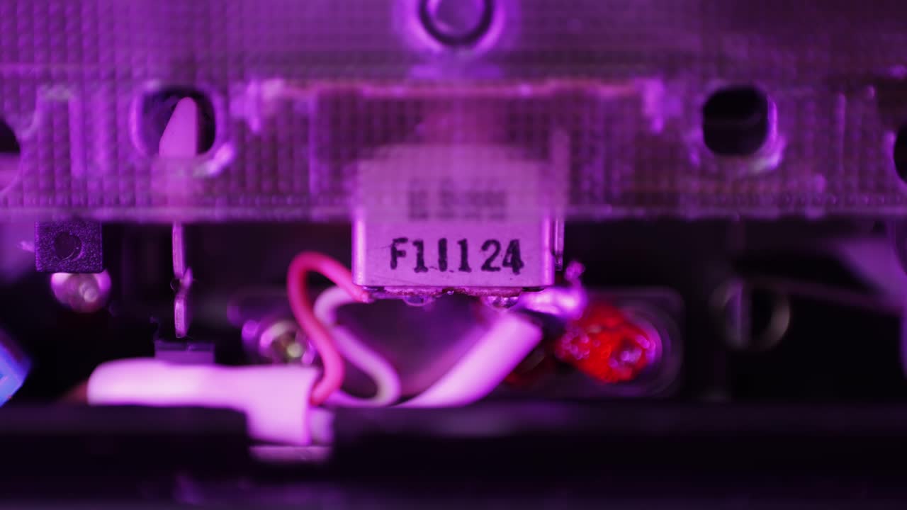 Retro radio tape recorder, audio cassette close-up. Listening to music, old radio boom box player, macro of vintage music listening.