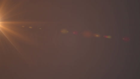 digital animation of orange spot of light against grey background