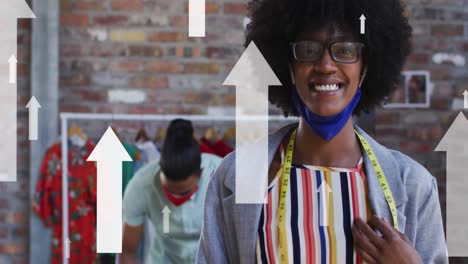 animation of arrows over diverse fashion designers working in face masks