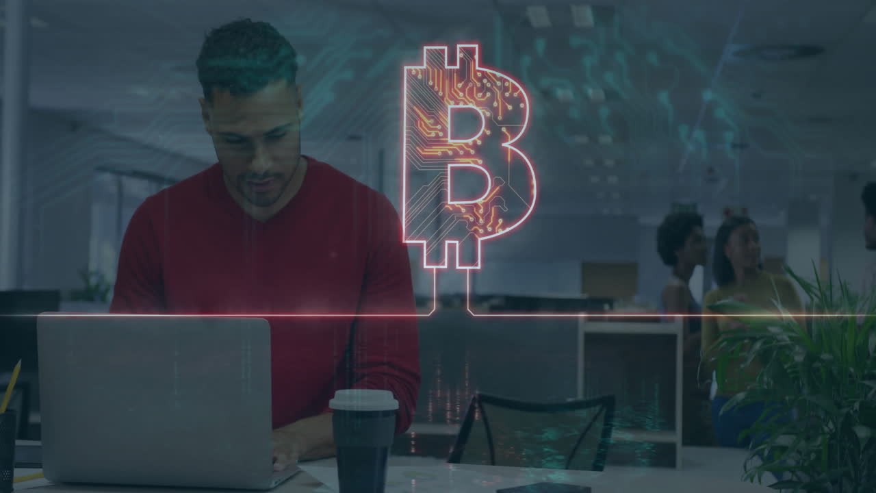 Bitcoin symbol animation over man working on laptop in modern office